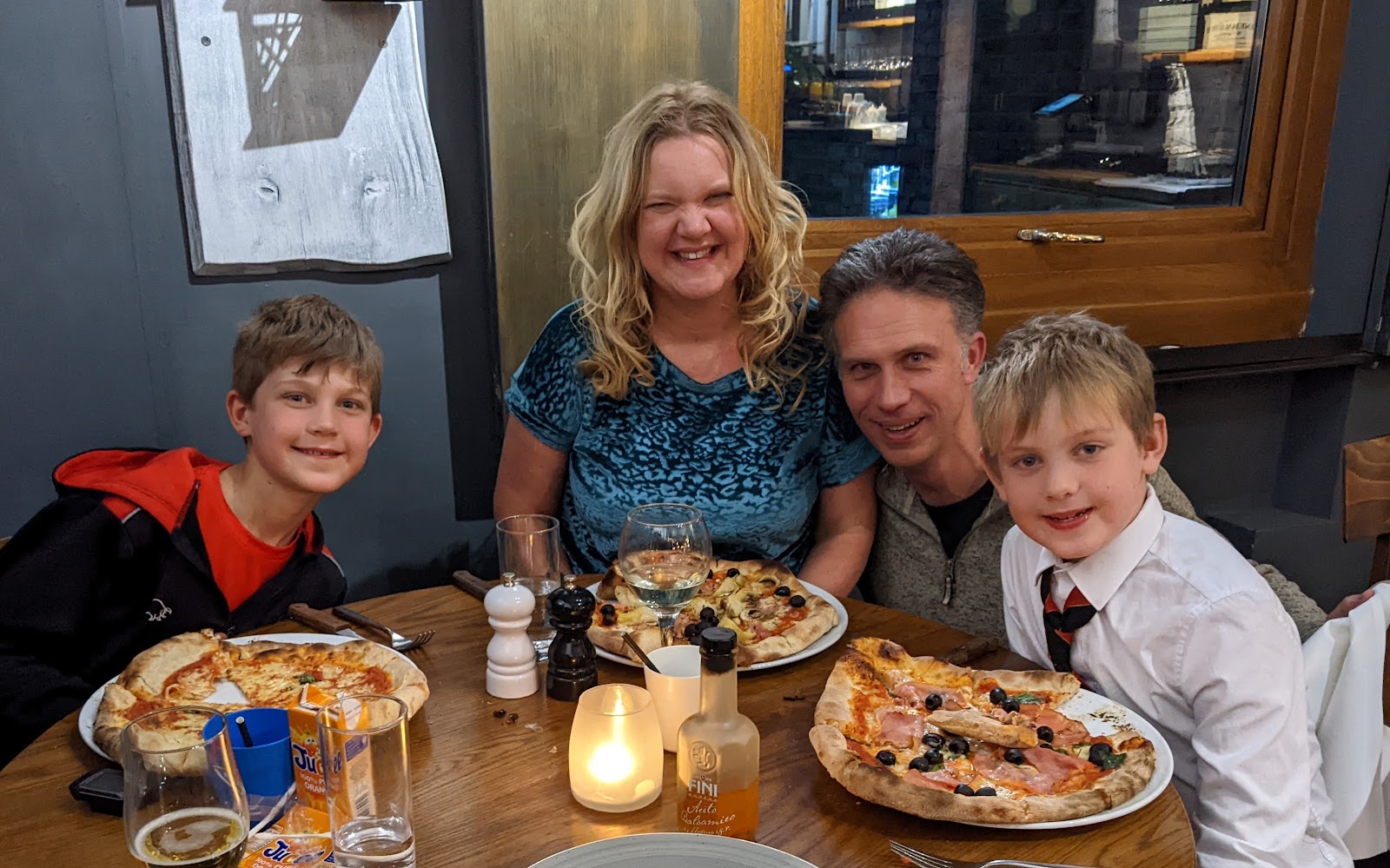 a photograph taken of the whole family at dinner at Del Posto in St Margarets