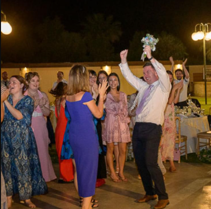 Patrick catching the bouquet